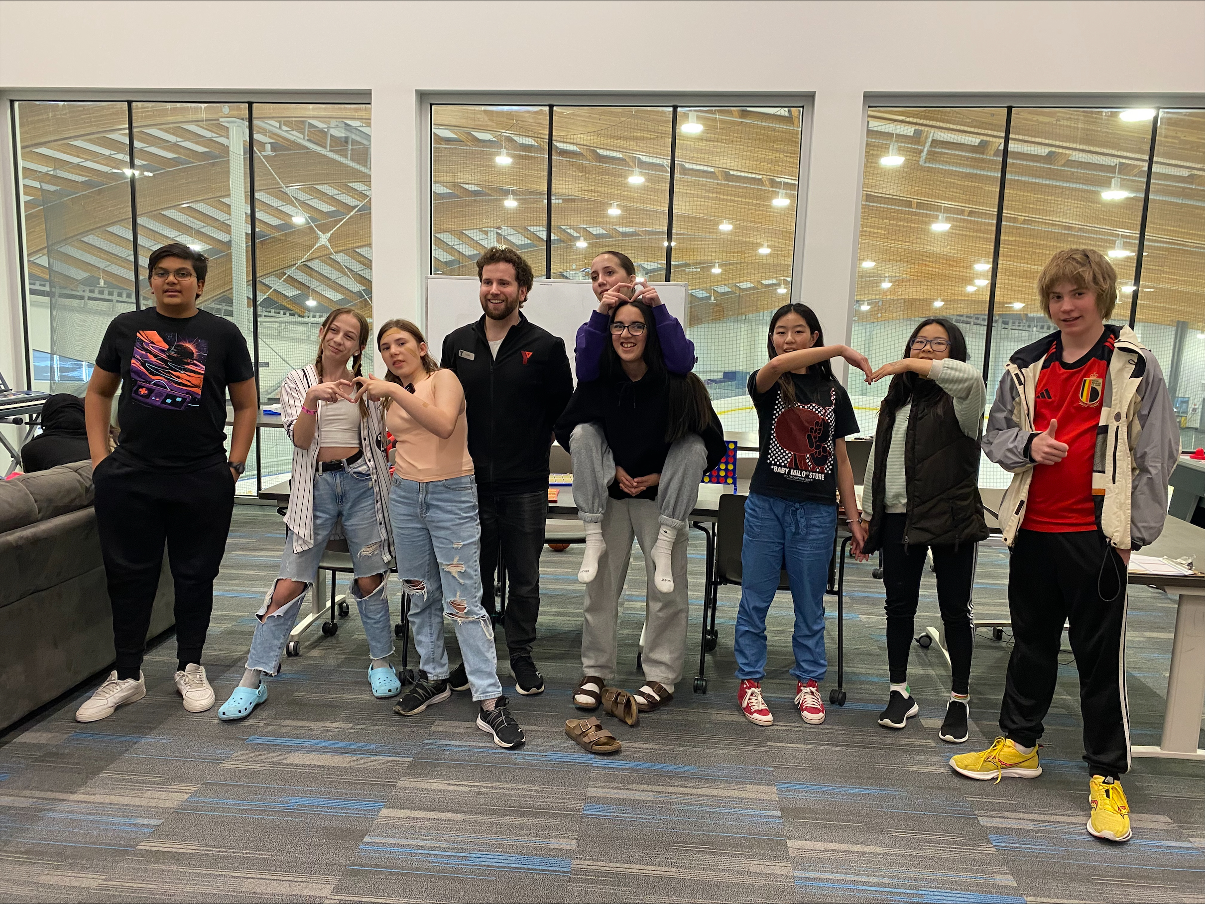 A group of young youth leaders pose for a photo appreciating volunteers