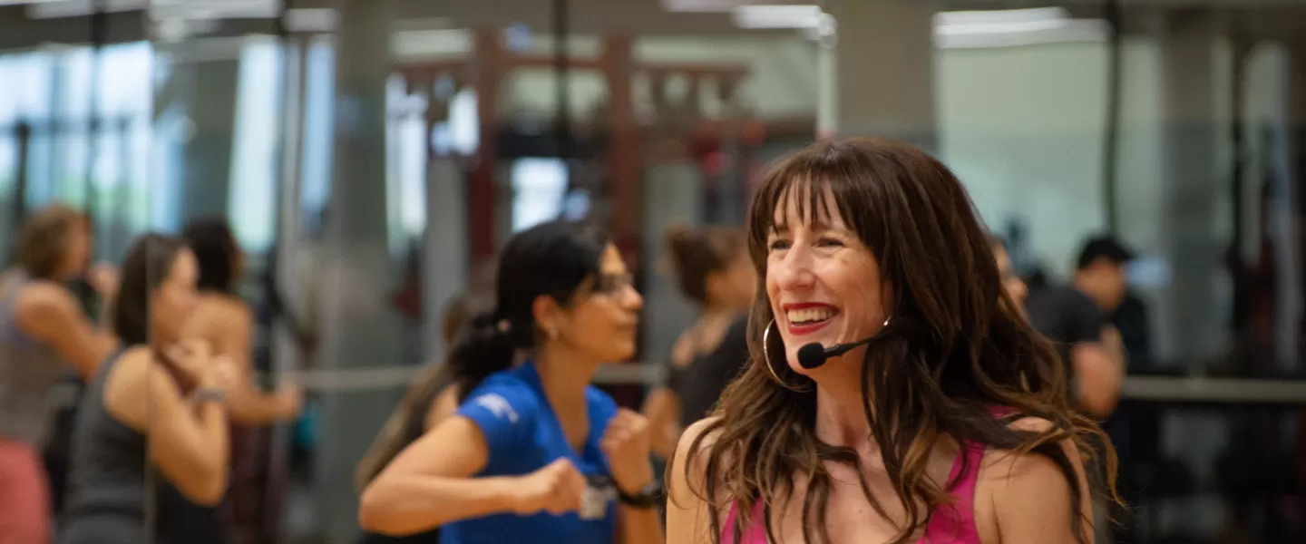 YMCA volunteer teaching a fitness class