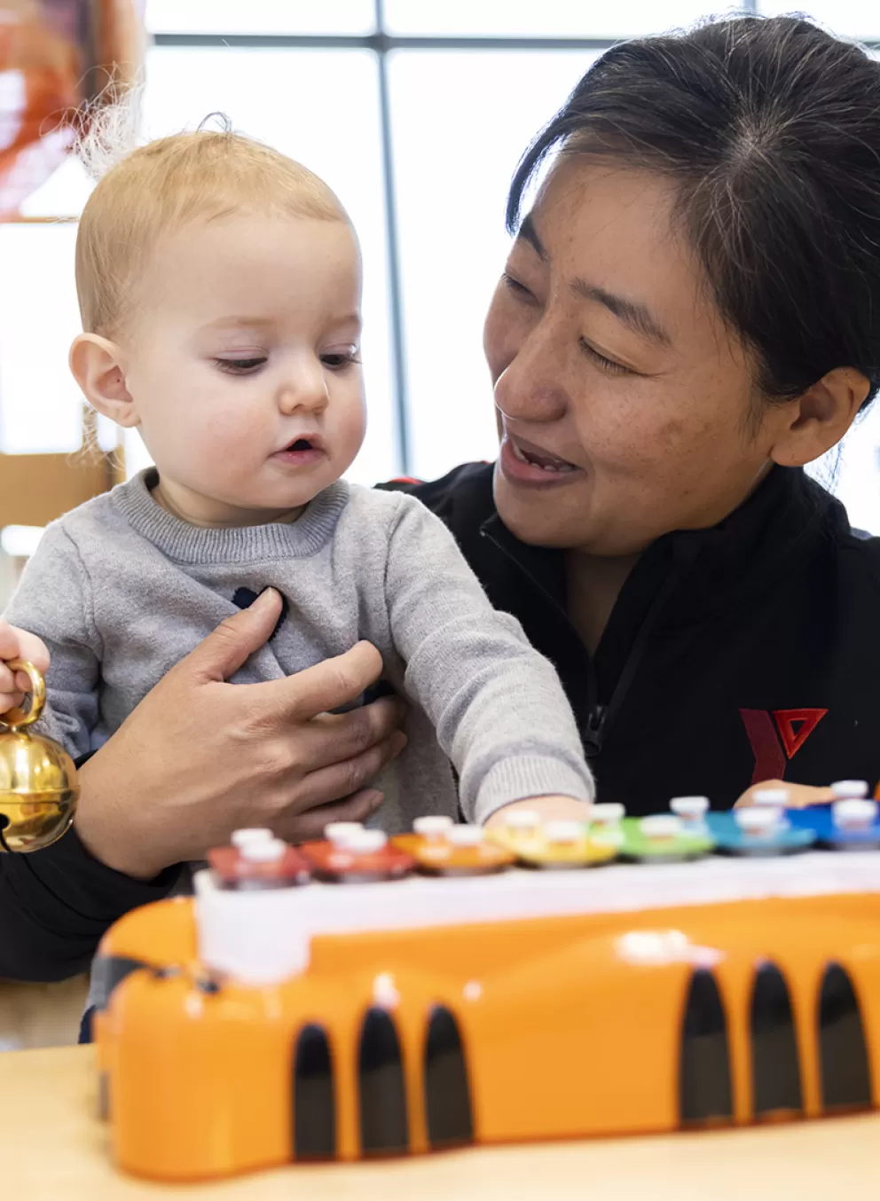 young child hugging educator