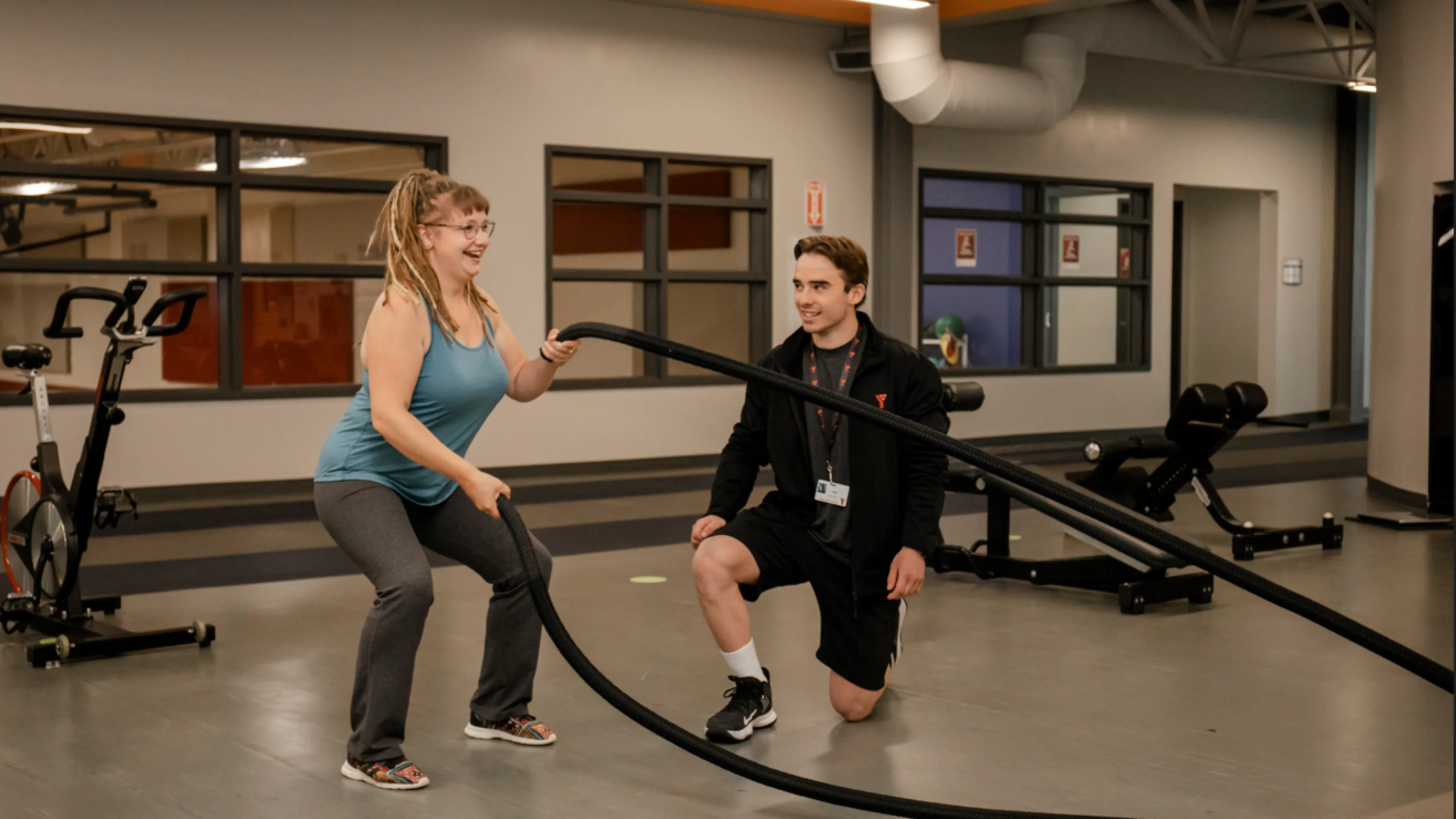 YFit - Certified trainer and client on weight floor