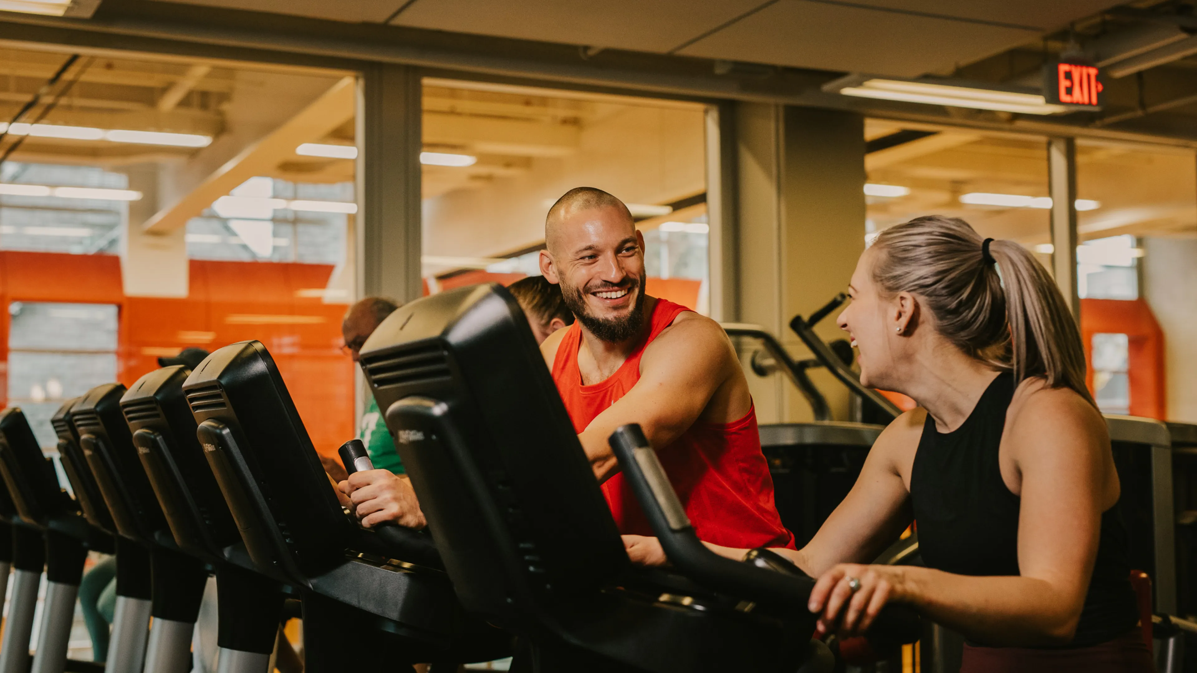 Male and female walking on the treadmill