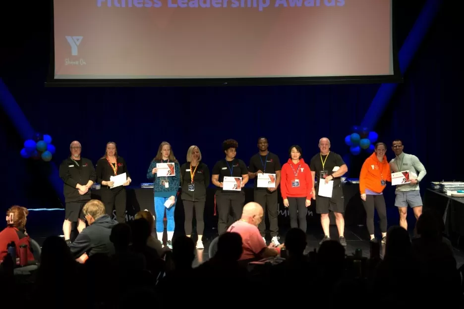 Group of people holding certificates