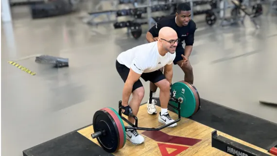 Personal Trainer and Client on the Weight Floor