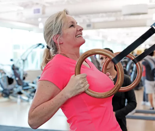A woman works out in a fitness facility