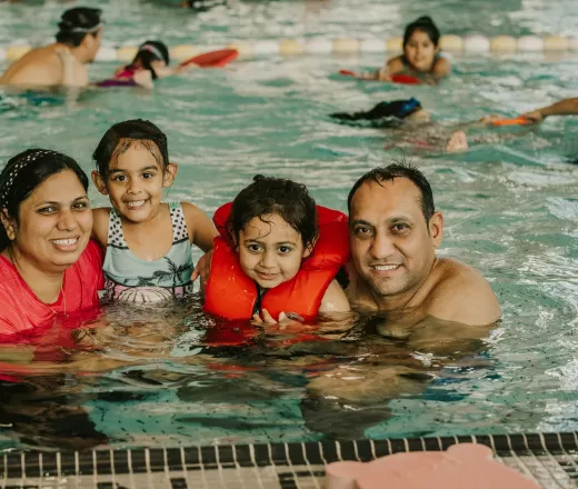 A family enjoys swimming