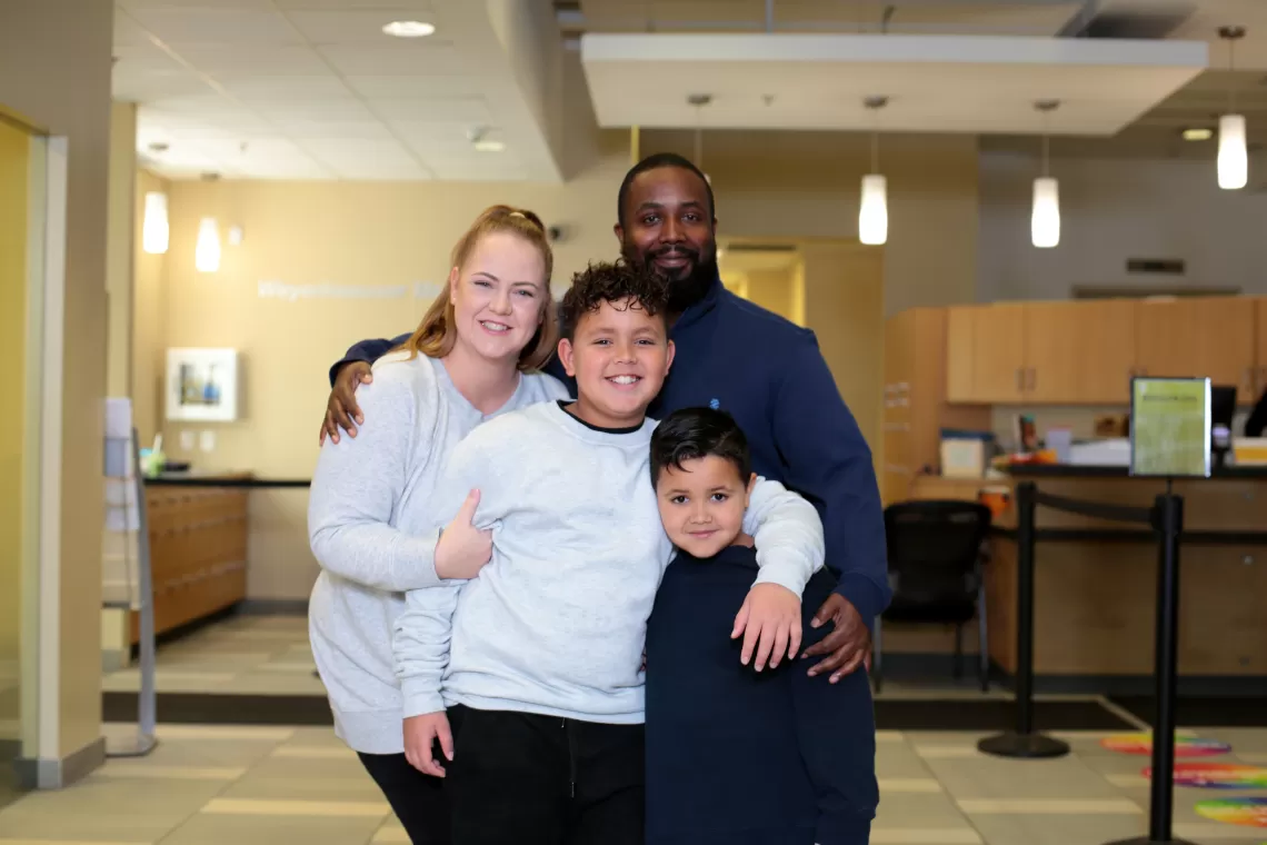 Family of 4 smiling